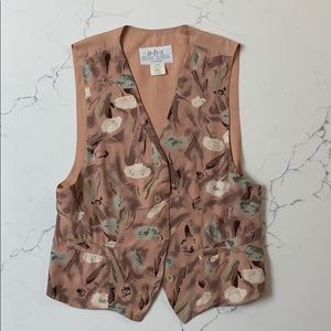 Floral print button down vest with adjustable back buckle to adjust fit